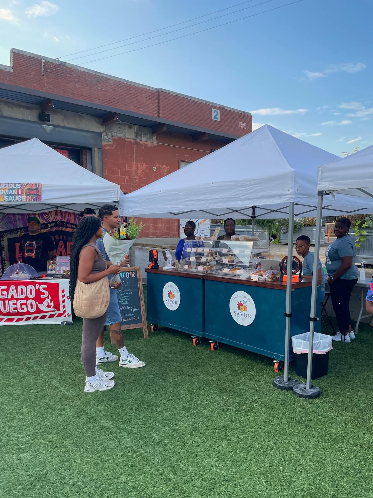 Two people browsing at the Camp North End Farmers Market