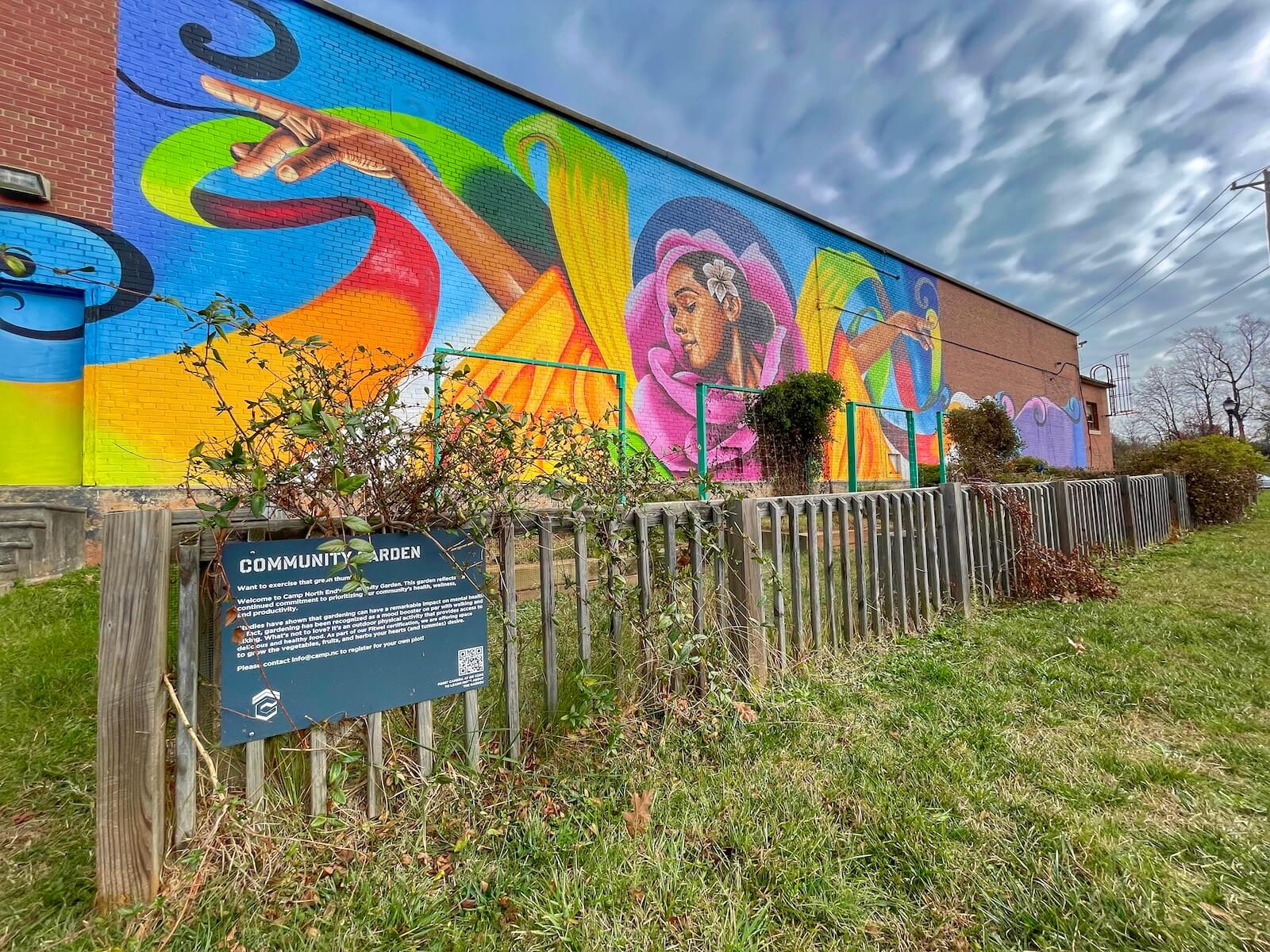Colorful mural provides contrast for a community garden at Camp North End Charlotte
