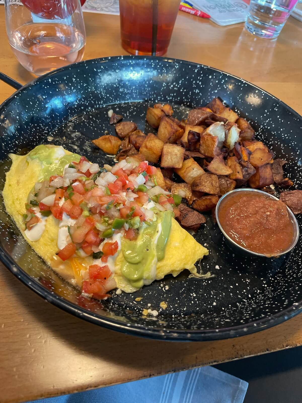 Brunch plate with an omelette and potatoes at State of Confusion in LoSo Charlotte
