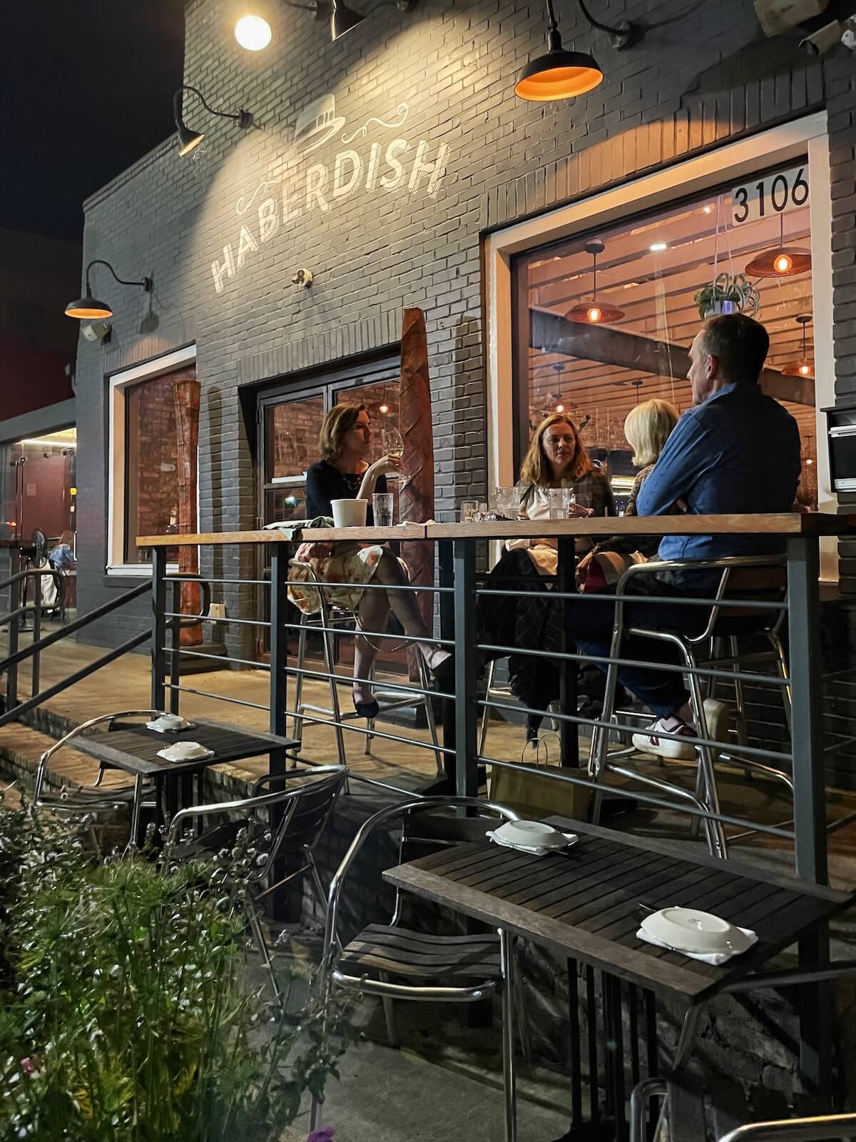 People eating dinner on the patio at Haberdish Restaurant in NoDa Charlotte
