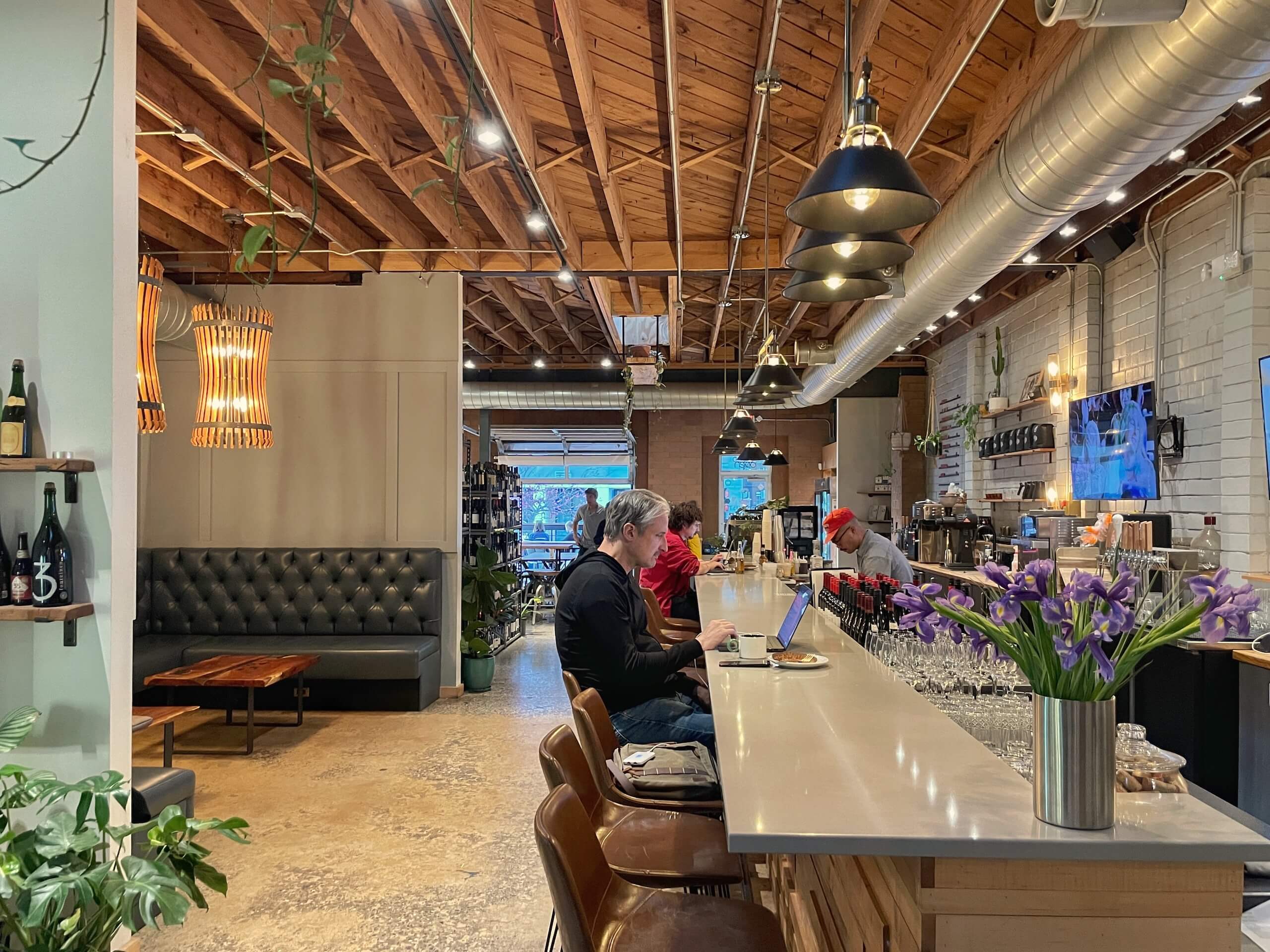 Man working at the bar at Hobbyist Cafe in Optimist Park Charlotte