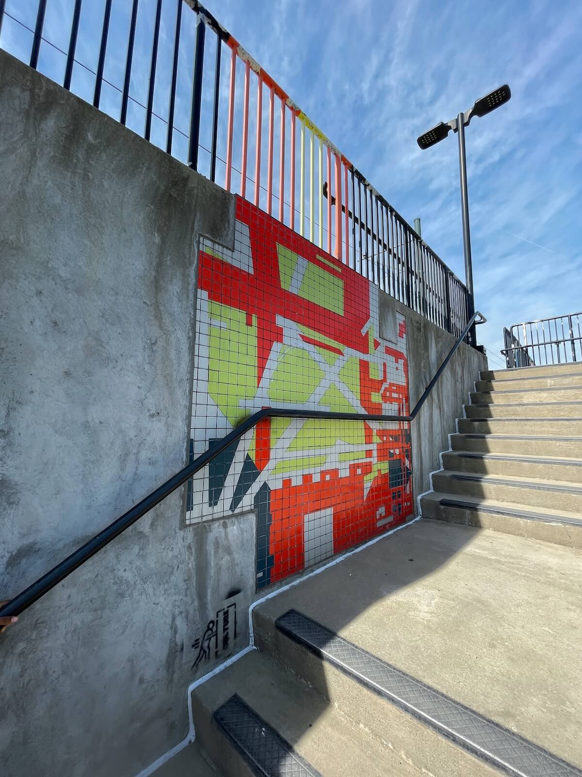 Public art on the steps leading to the Parkwood light rail stop in Optimist Park Charlotte