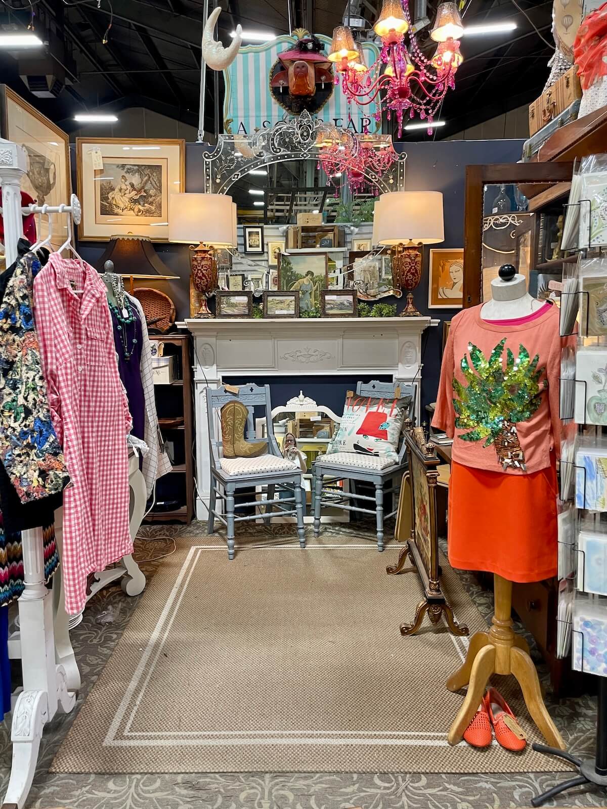 Small room filled with antique collectibles, gifts, and clothes at Sleepy Poet in LoSo Charlotte