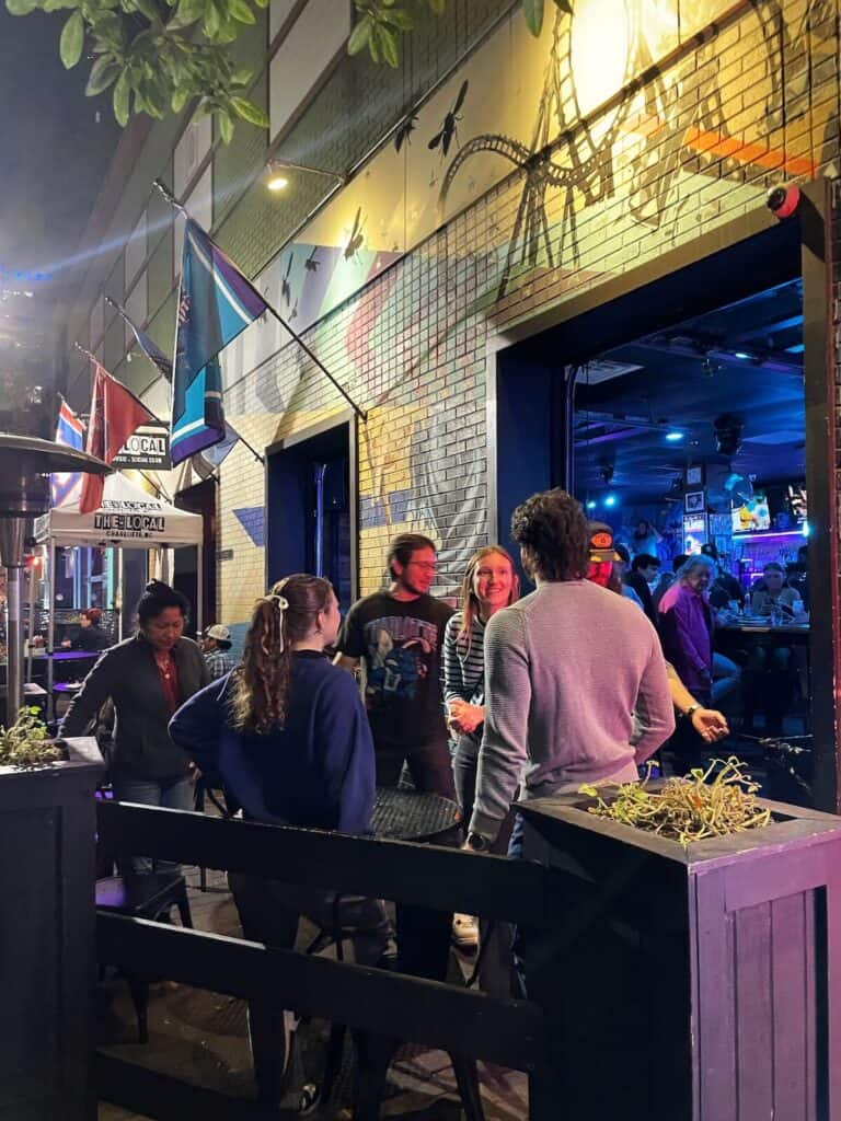 People drinking beer outside at The Local in Uptown Charlotte