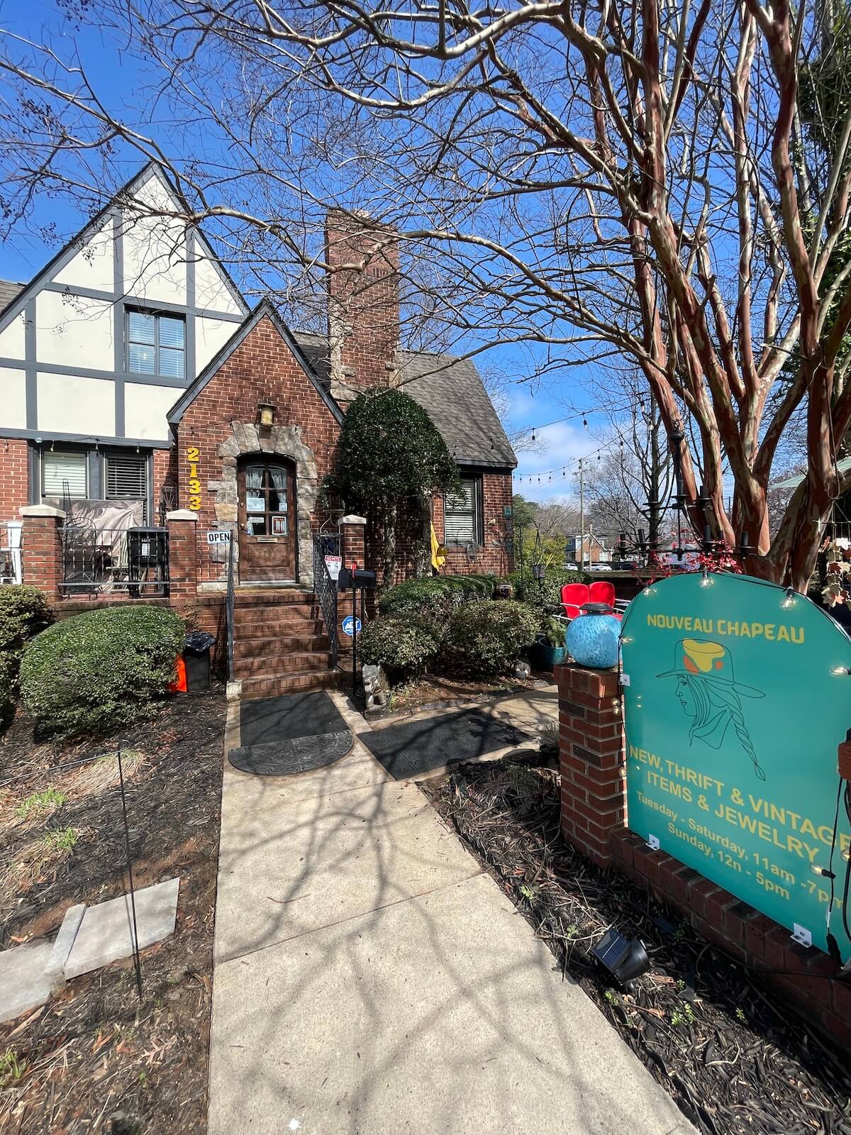 Outside of a historic home used as a vintage clothing shop in Plaza Midwood