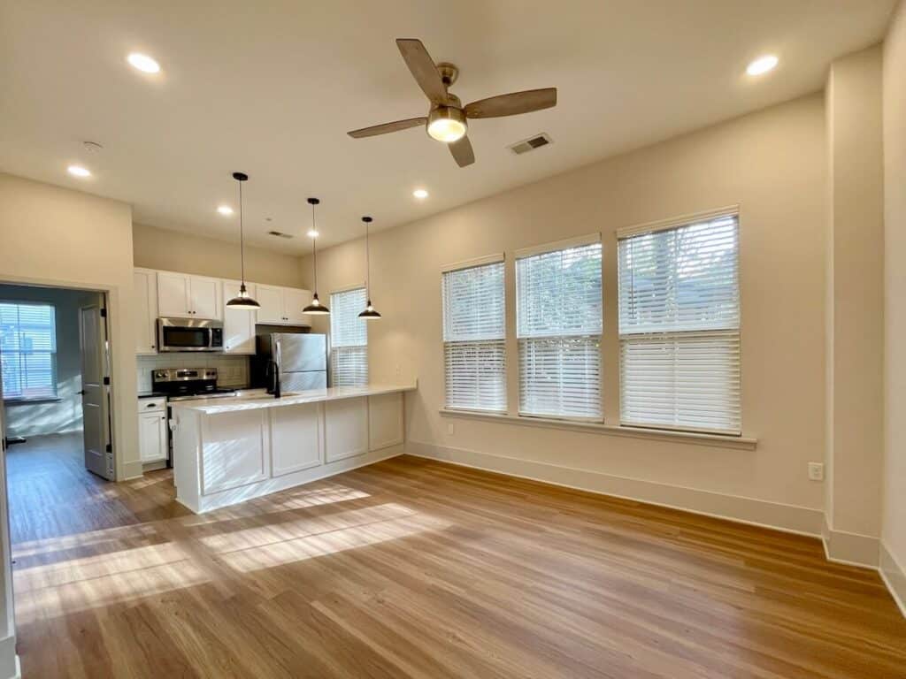One bedroom flat at Anker Haus in Charlotte with big windows. Light filled kitchen with inviting breakfast bar.