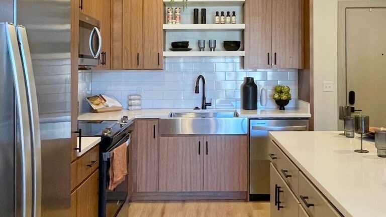 Cover photo for How to Apartment Locators Get Paid? post. With a modern kitchen with warm wood finishes